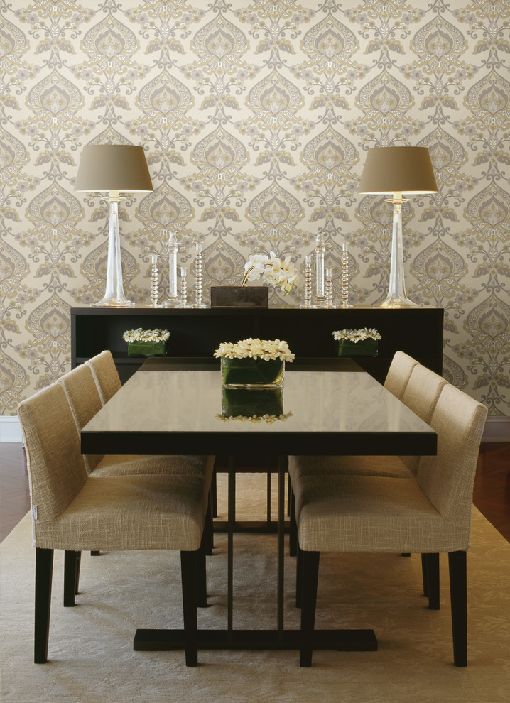 This is an example of a contemporary dining room in Boston with feature lighting.