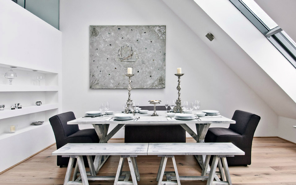 Trendy medium tone wood floor dining room photo in Other with white walls