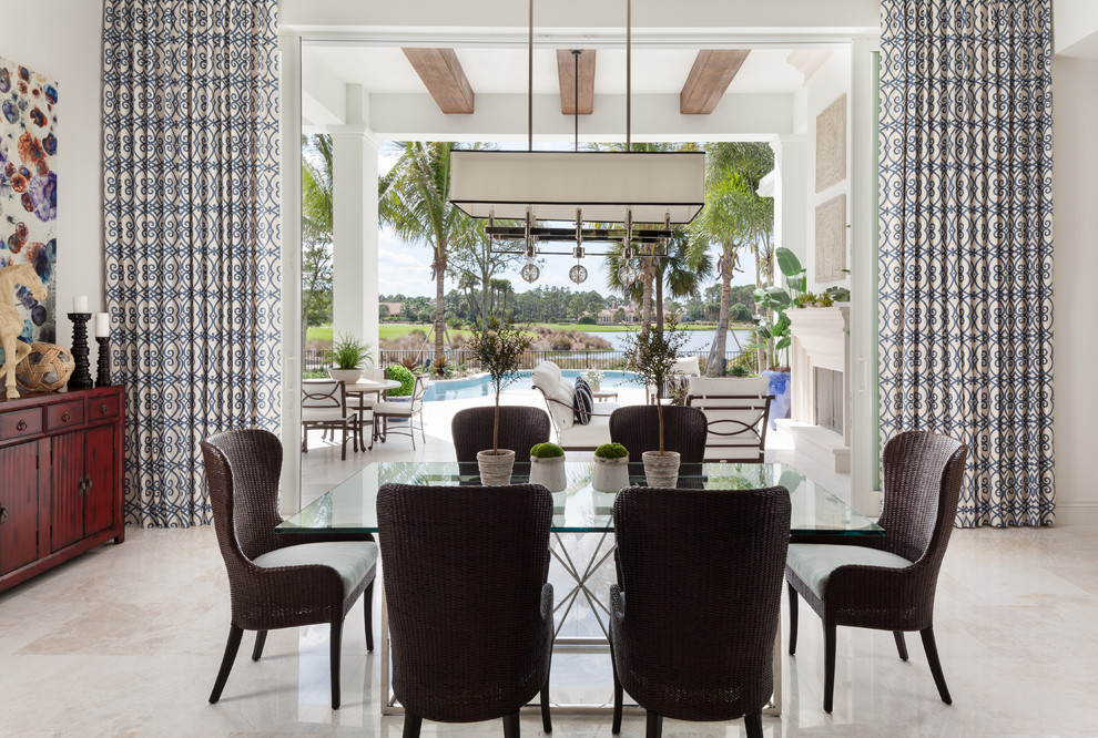 Beach style beige floor dining room photo in Miami with white walls