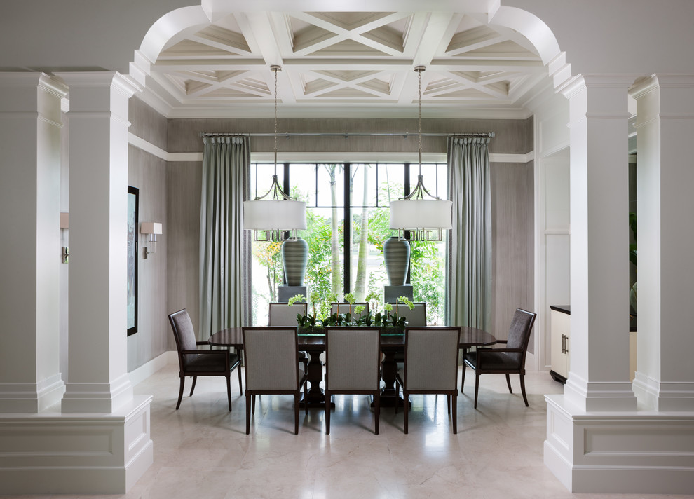 Photo of a traditional dining room in Miami with feature lighting.
