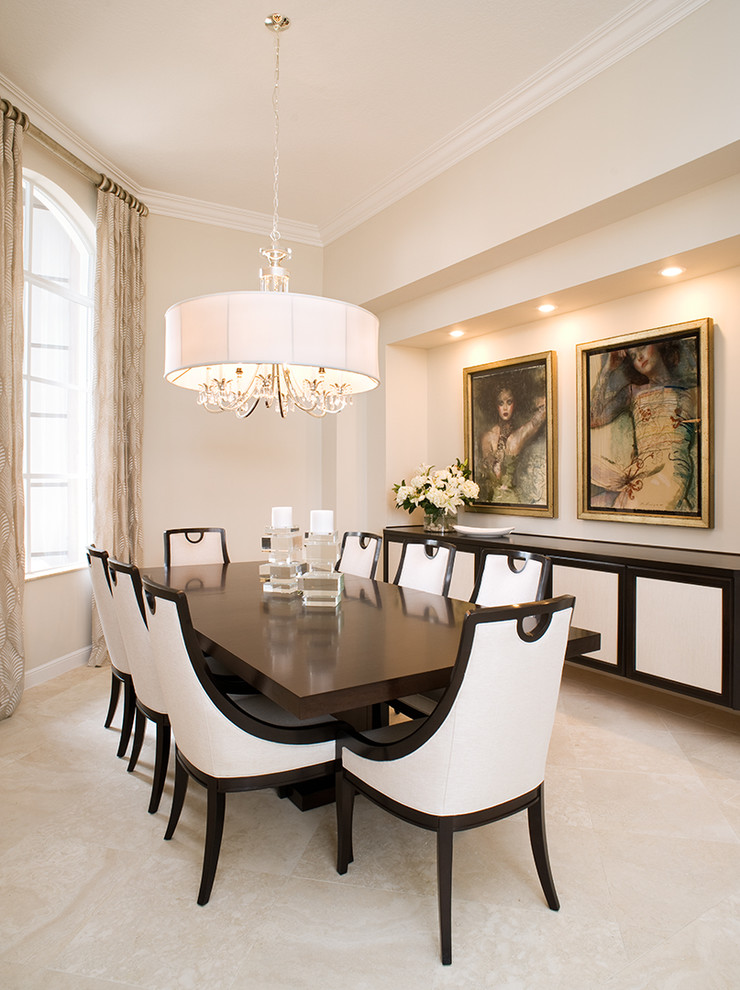 This is an example of a medium sized classic enclosed dining room in Miami with white walls.