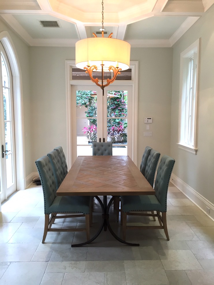 Medium sized traditional enclosed dining room in Miami with beige walls, limestone flooring, no fireplace and beige floors.