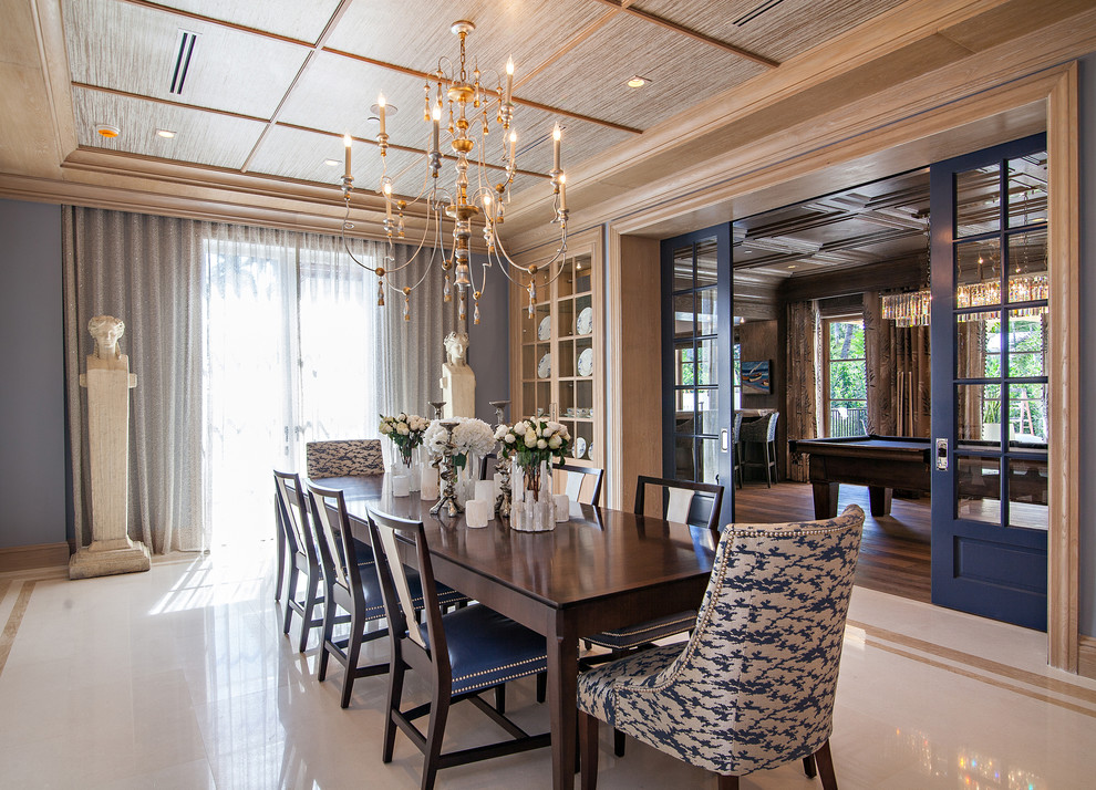 Example of a huge transitional porcelain tile dining room design in Miami with blue walls
