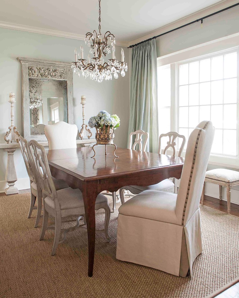 Ornate dark wood floor dining room photo in Little Rock with gray walls