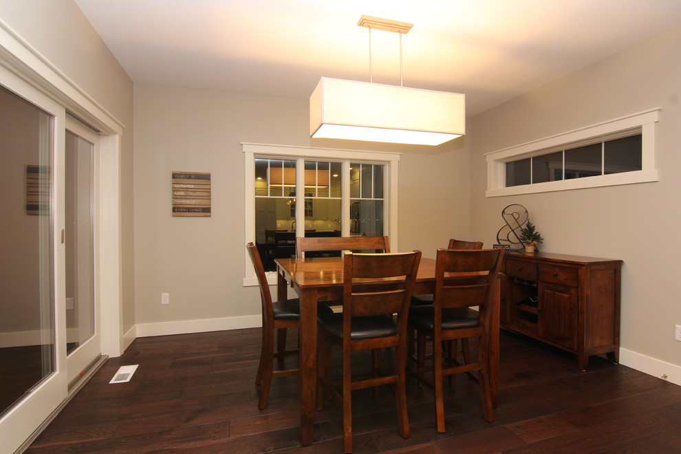 Medium sized classic kitchen/dining room in Cedar Rapids with grey walls and medium hardwood flooring.