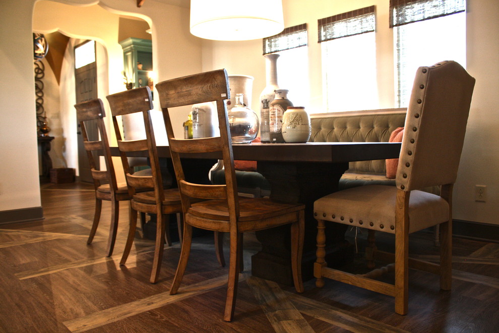 This is an example of an eclectic dining room in Austin with beige walls and vinyl flooring.