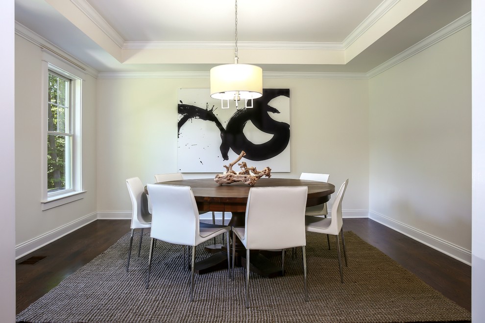 Inspiration for a classic enclosed dining room in New York with beige walls, dark hardwood flooring and brown floors.