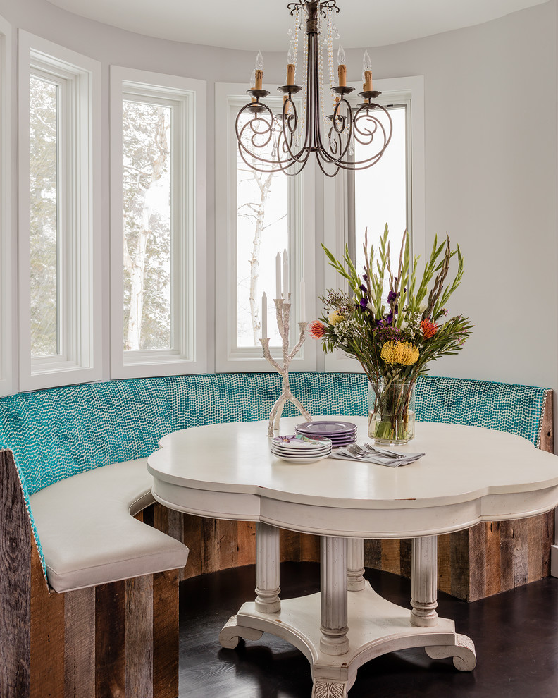 Example of an eclectic dark wood floor dining room design in Salt Lake City with white walls