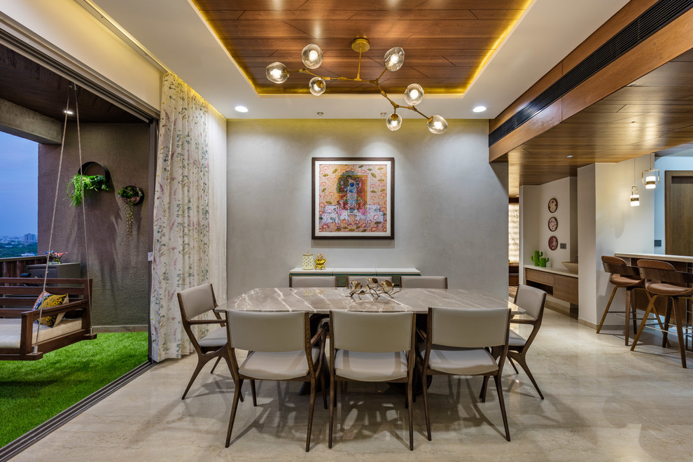 Dining room - modern dining room idea in Ahmedabad