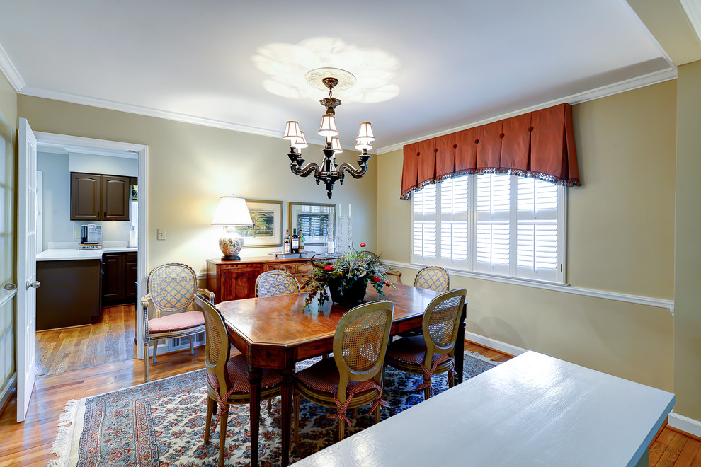 Medium sized traditional enclosed dining room in Atlanta with medium hardwood flooring, beige walls, no fireplace and brown floors.