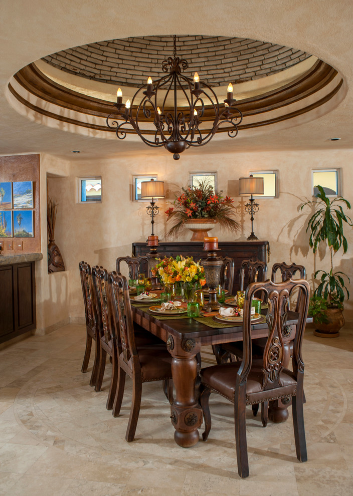 Photo of a mediterranean dining room in Mexico City with travertine flooring.