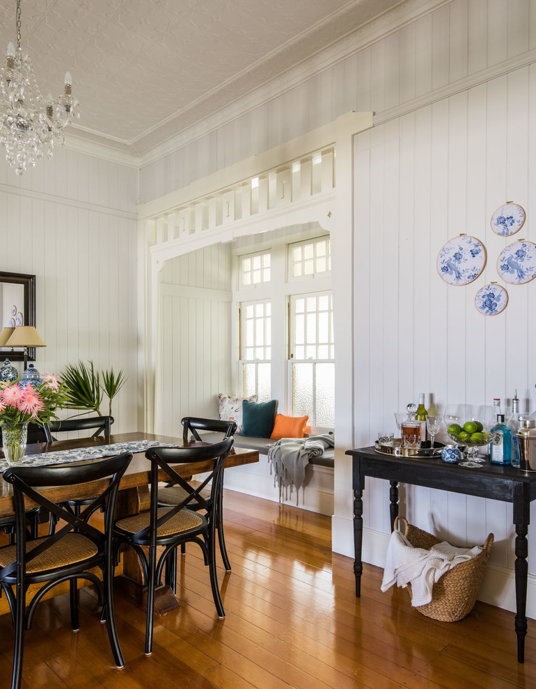 Inspiration for a large traditional enclosed dining room in Brisbane with grey walls and light hardwood flooring.