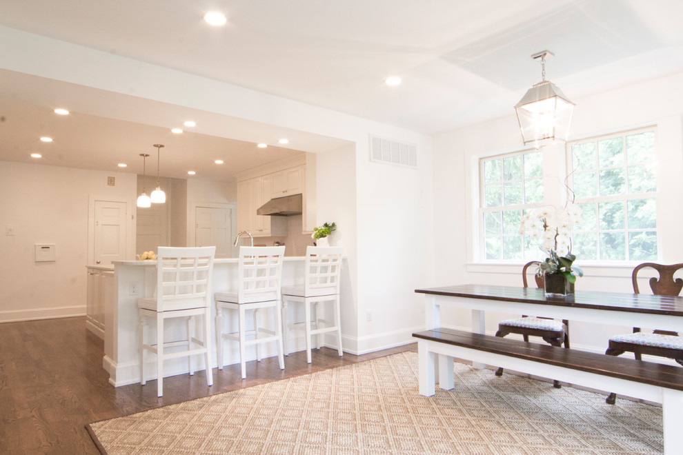 Inspiration for a large country medium tone wood floor and brown floor kitchen/dining room combo remodel in Philadelphia with white walls and no fireplace