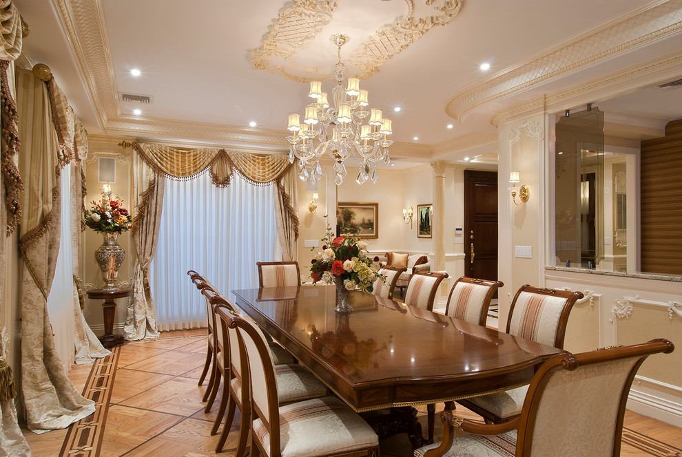 Large traditional enclosed dining room in New York with beige walls, medium hardwood flooring and no fireplace.