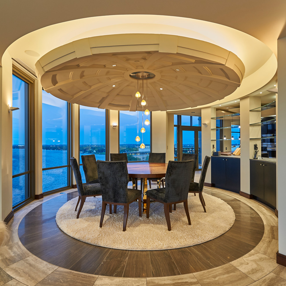 Dining room - large contemporary marble floor dining room idea in Other
