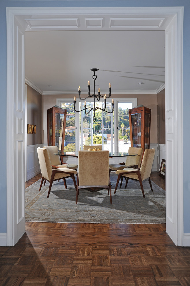Enclosed dining room - mid-sized transitional medium tone wood floor enclosed dining room idea in Other with metallic walls and no fireplace