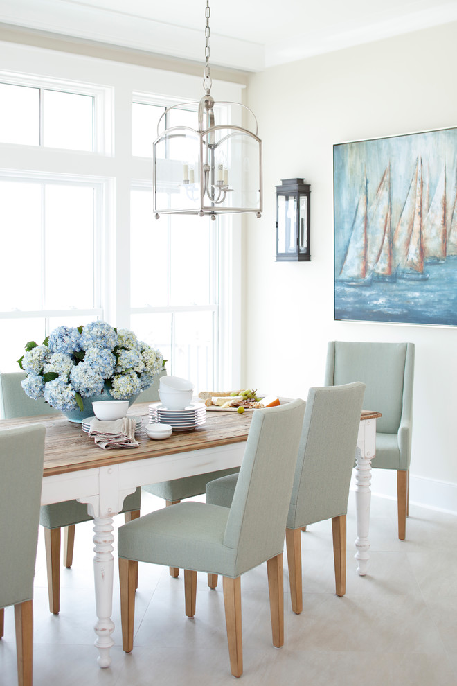 Design ideas for a large nautical dining room in Miami with marble flooring and beige walls.