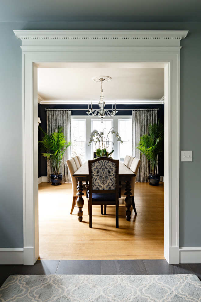 Design ideas for a large traditional kitchen/dining room in Portland with blue walls and light hardwood flooring.