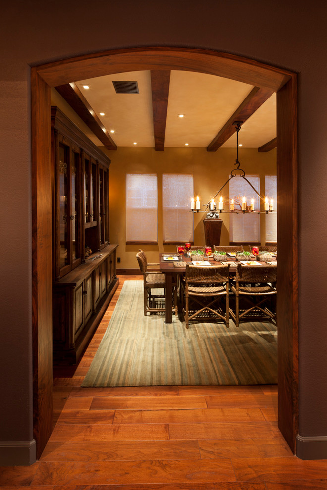 Large mountain style dark wood floor enclosed dining room photo in San Francisco with brown walls and no fireplace