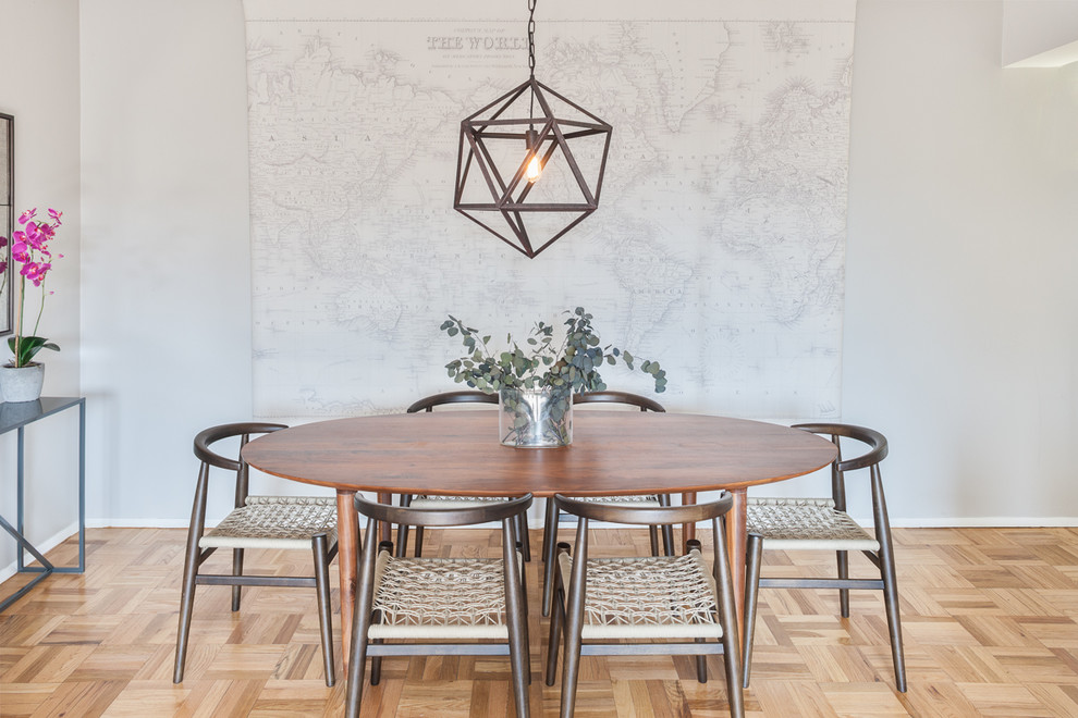 Inspiration for a contemporary light wood floor dining room remodel in New York with gray walls