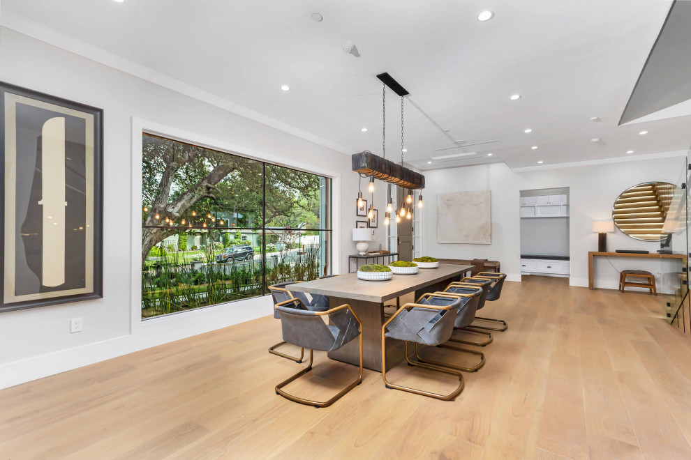Dining room - large contemporary light wood floor, beige floor and tray ceiling dining room idea in Los Angeles with gray walls and no fireplace