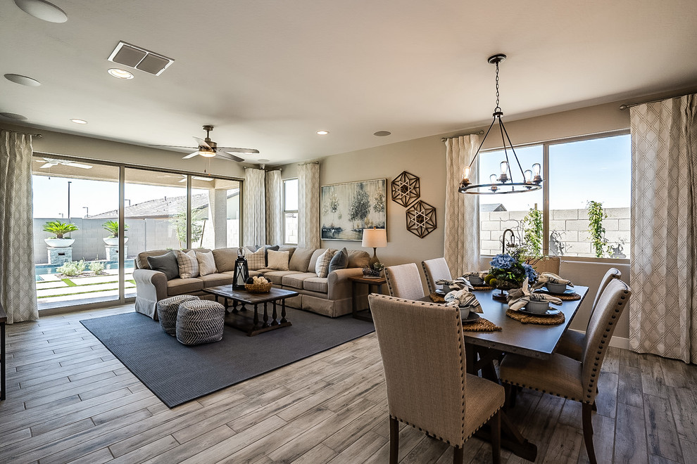 This is an example of a medium sized contemporary open plan dining room in Phoenix with beige walls, medium hardwood flooring and beige floors.