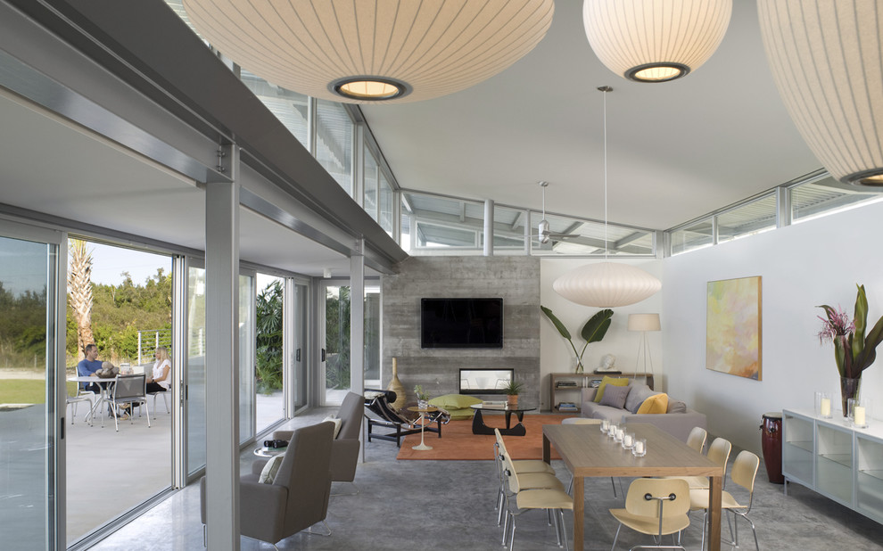 Modernes Esszimmer mit Betonboden in Miami