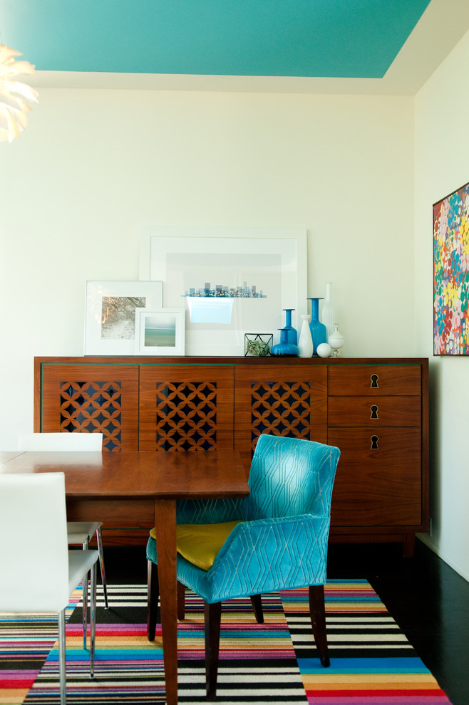 Example of a mid-sized 1960s dark wood floor enclosed dining room design in San Francisco with beige walls and no fireplace