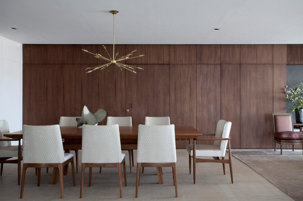 Design ideas for a contemporary dining room in London with brown walls and beige floors.