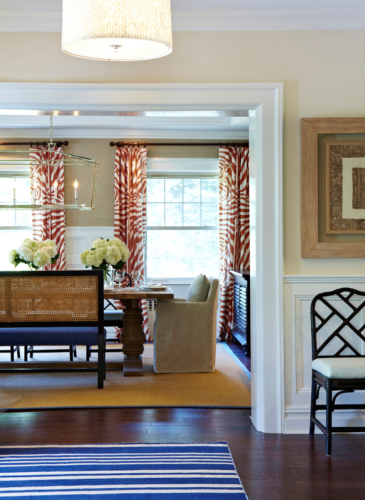 Example of a large transitional dark wood floor enclosed dining room design in New York with no fireplace and beige walls