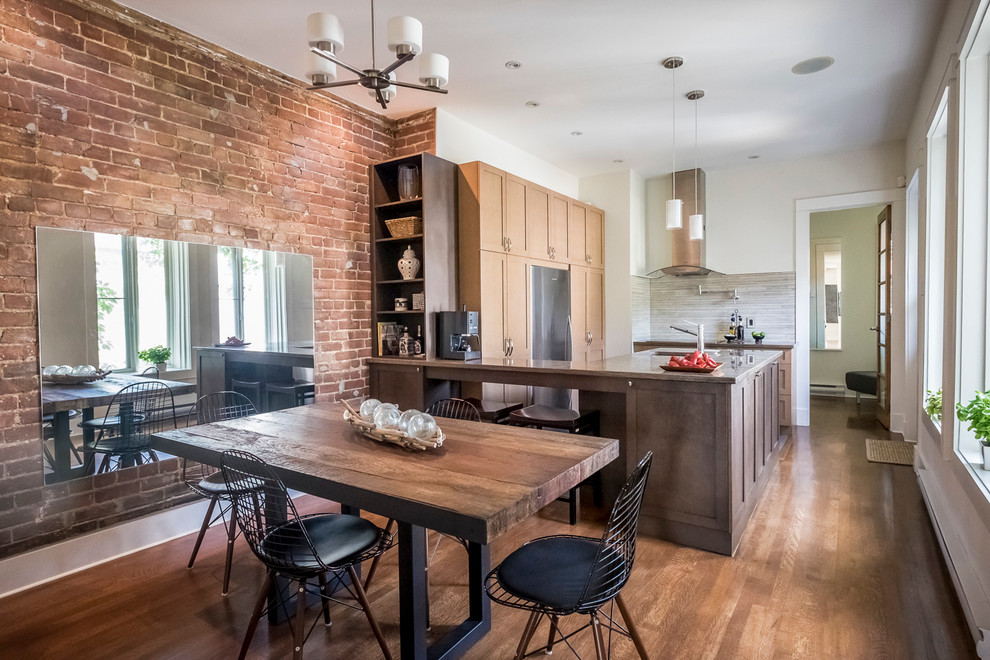 Kitchen/dining room combo - industrial dark wood floor kitchen/dining room combo idea in Montreal with white walls and no fireplace