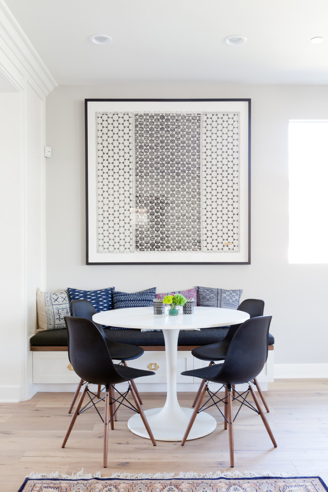 Dining room - transitional light wood floor dining room idea in Los Angeles with gray walls