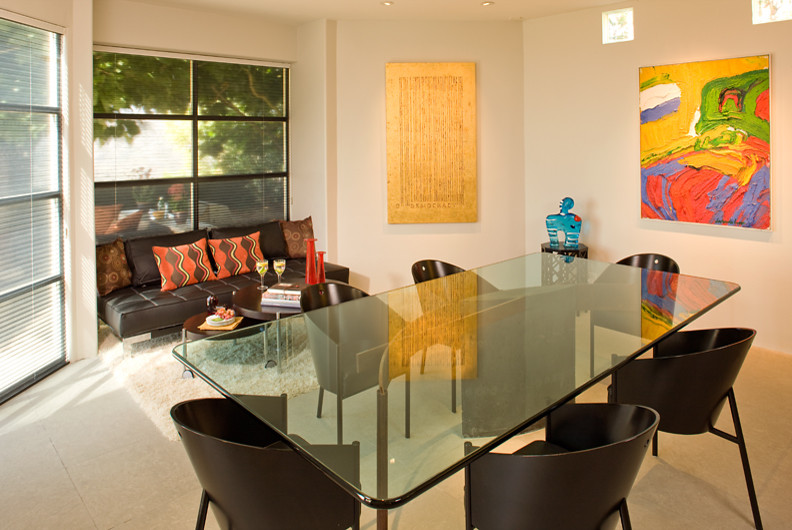 Photo of a medium sized contemporary enclosed dining room in Los Angeles with beige walls and grey floors.