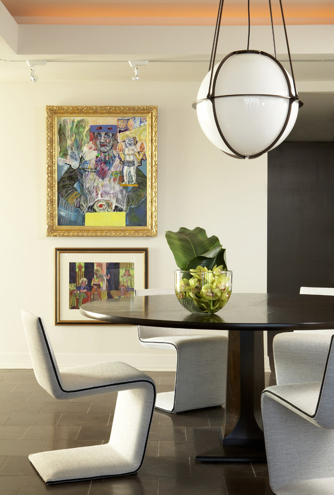 Photo of a modern dining room in Atlanta with white walls and ceramic flooring.