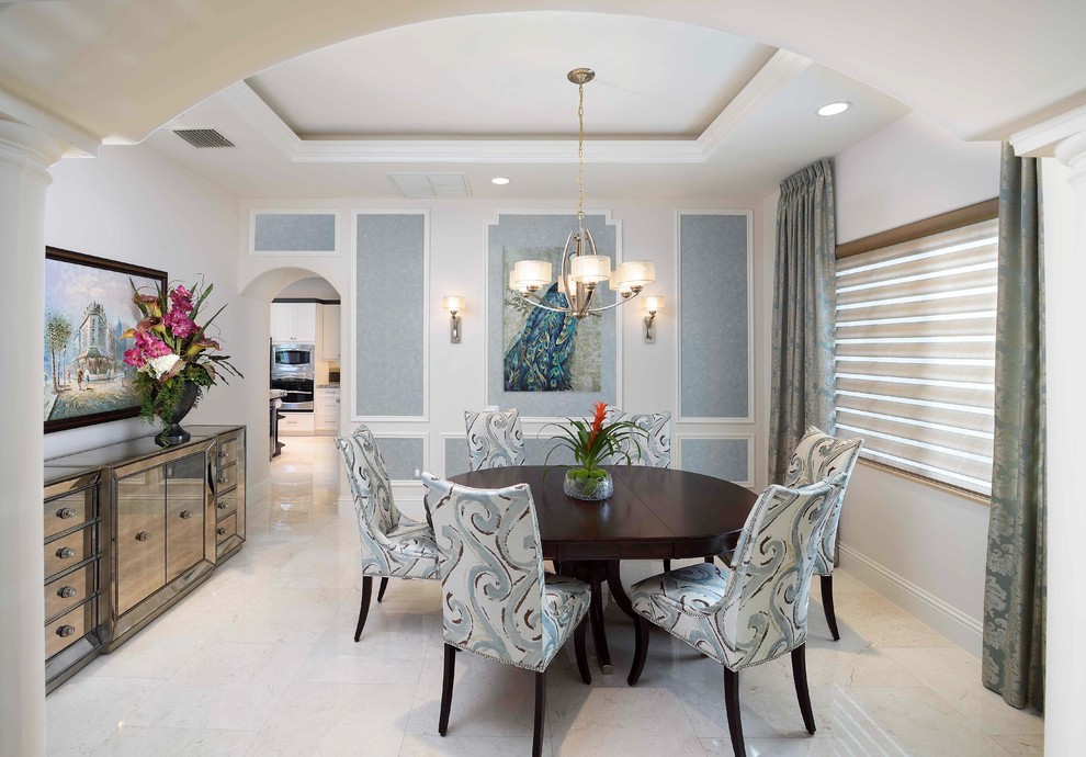 Design ideas for a small nautical enclosed dining room in Miami with white walls and limestone flooring.