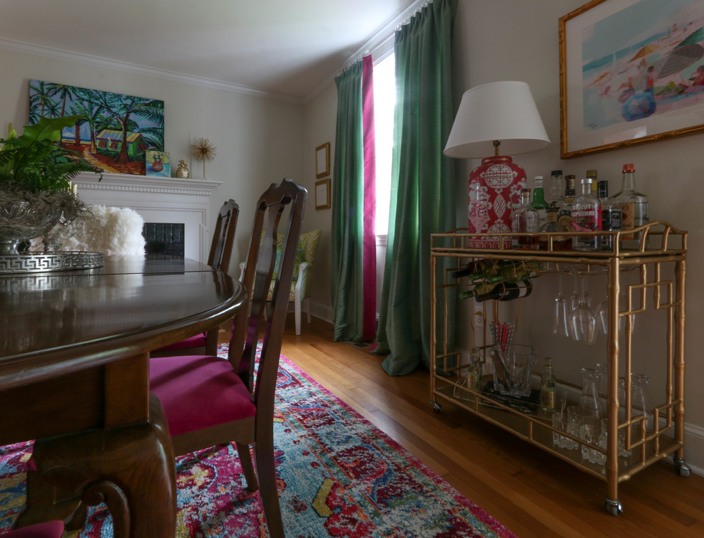 Example of a mid-sized eclectic light wood floor and brown floor great room design in Richmond with beige walls and no fireplace