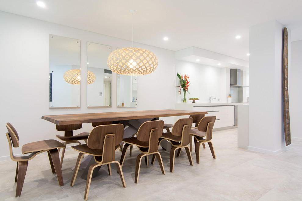 This is an example of a contemporary dining room in Cairns.