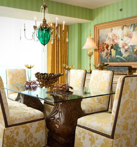 Example of an eclectic dining room design in Milwaukee with green walls