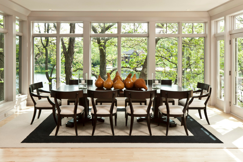 Inspiration for a contemporary light wood floor dining room remodel in Milwaukee