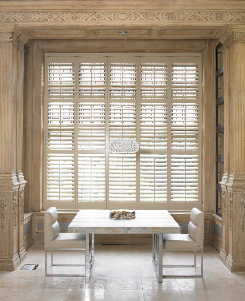 This is an example of a small contemporary enclosed dining room in London with beige walls and no fireplace.