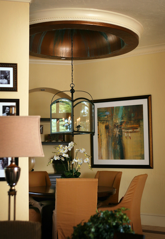 Tuscan dining room photo in Orlando with beige walls