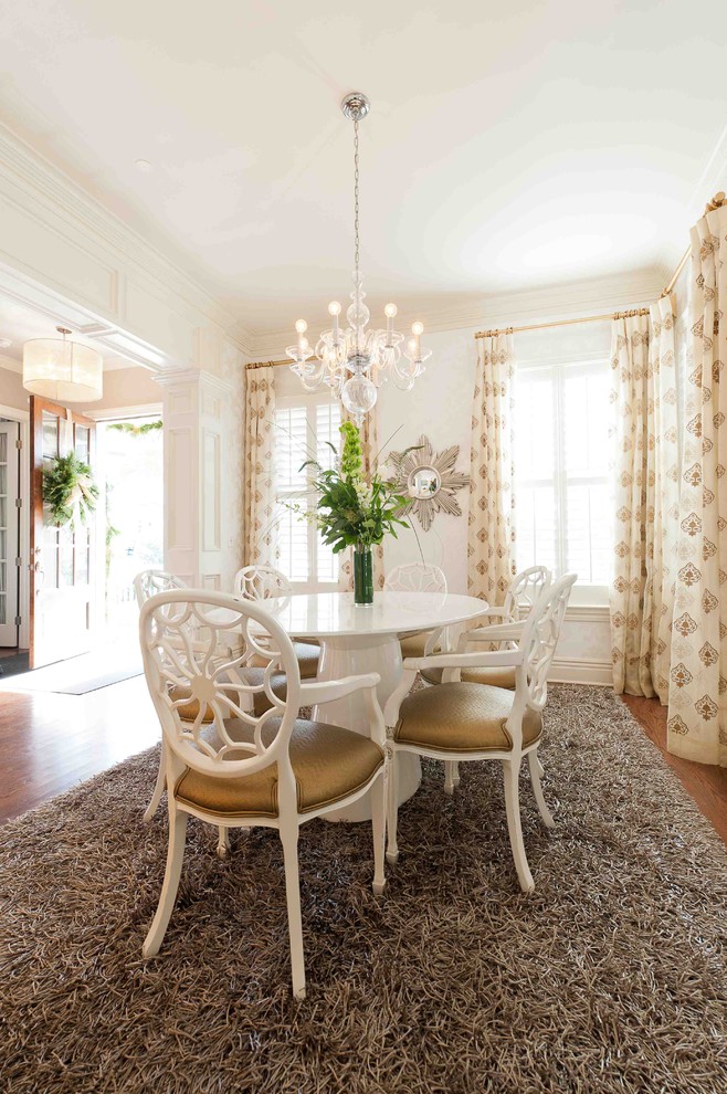 Inspiration for a classic enclosed dining room in DC Metro with white walls and dark hardwood flooring.
