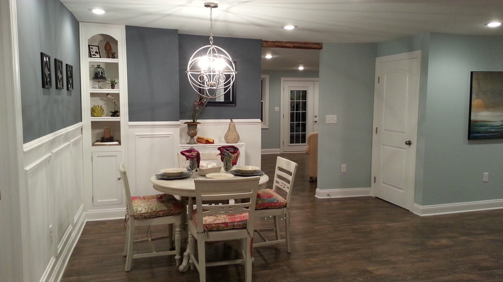 Small transitional dark wood floor dining room photo in New York with gray walls