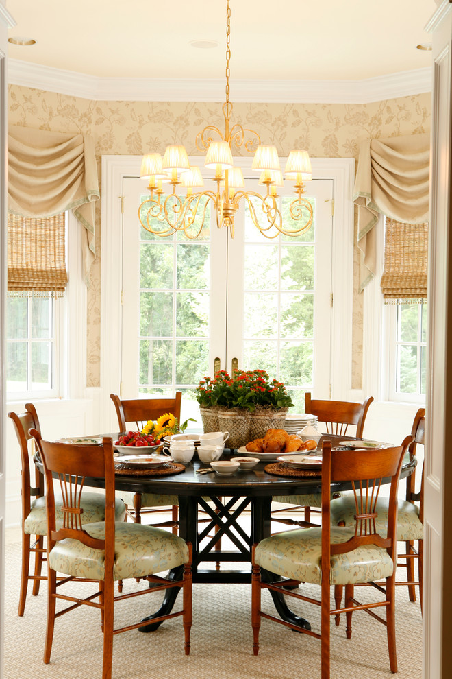 This is an example of a medium sized traditional dining room in New York with medium hardwood flooring, beige walls and no fireplace.