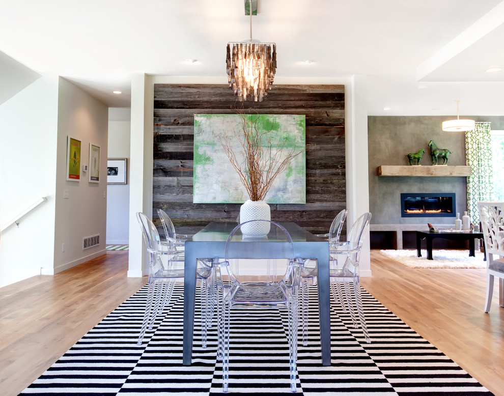 Great room - contemporary medium tone wood floor great room idea in Minneapolis with white walls