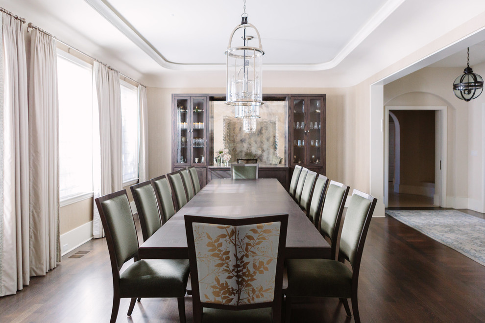Photo of a large traditional enclosed dining room in Chicago with beige walls, dark hardwood flooring and brown floors.