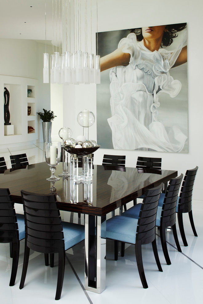 Inspiration for a contemporary dining room in Miami with white walls and white floors.