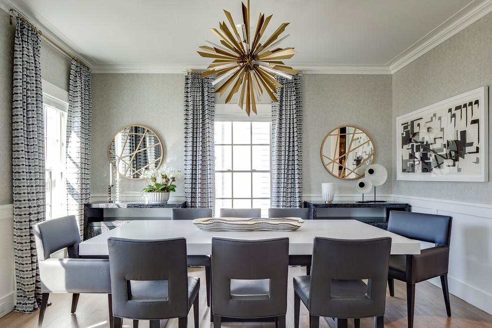 Inspiration for a mid-sized contemporary light wood floor enclosed dining room remodel in New York with gray walls