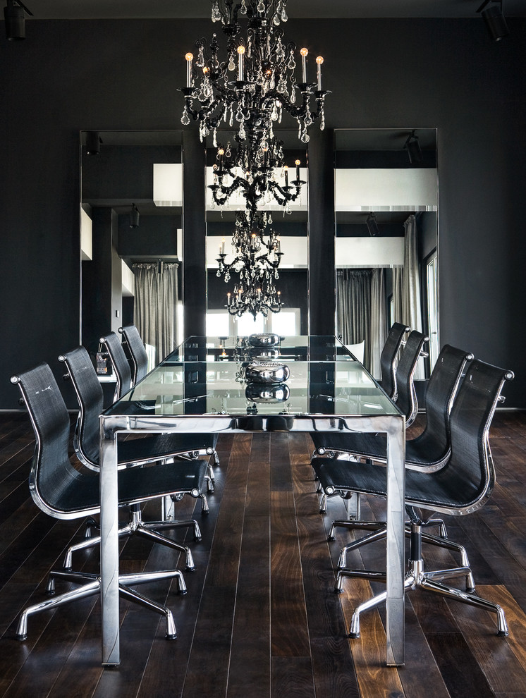 Inspiration for a contemporary enclosed dining room in London with dark hardwood flooring and black walls.