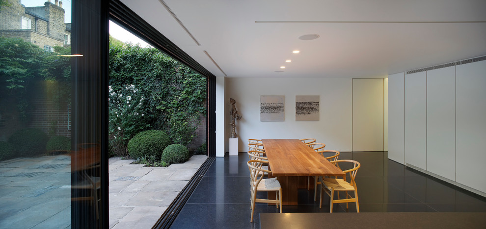 Источник вдохновения для домашнего уюта: столовая в стиле модернизм с белыми стенами